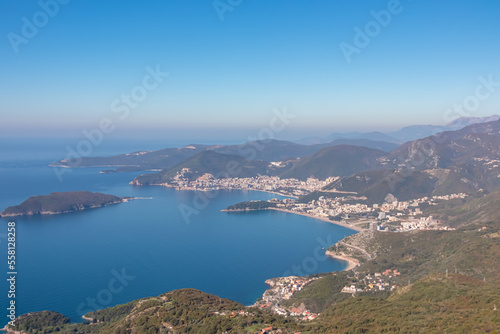 Panoramic aerial view on the coastline of Budva and Sveti Nikola Island seen from Goli Vrh, Adriatic Mediterranean Sea, Montenegro, Balkan, Europe. Luxury hotel resorts along Budvanian Riviera. © Chris