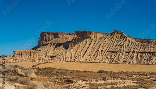 Bardenas sand desert formations in Navarre under blue sky