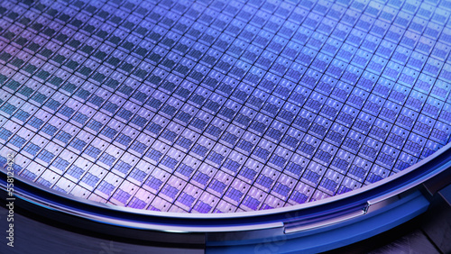 Macro Shot of a Silicon Wafer with Computer Chips during Manufacturing Process at Fab or Foundry. Semicondutor Wafer Texture. photo