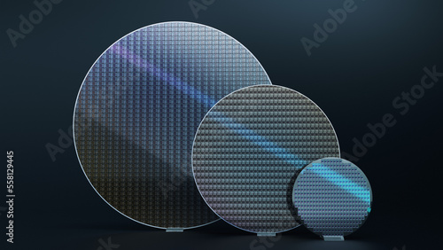 Set of Three Silicon Wafers of Different Sizes, 300mm, 200mm and 100mm, on Dark Background photo