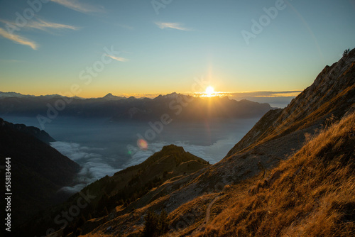 Sunset Swiss Alps. Mountains at sunset. Fog in the mountains