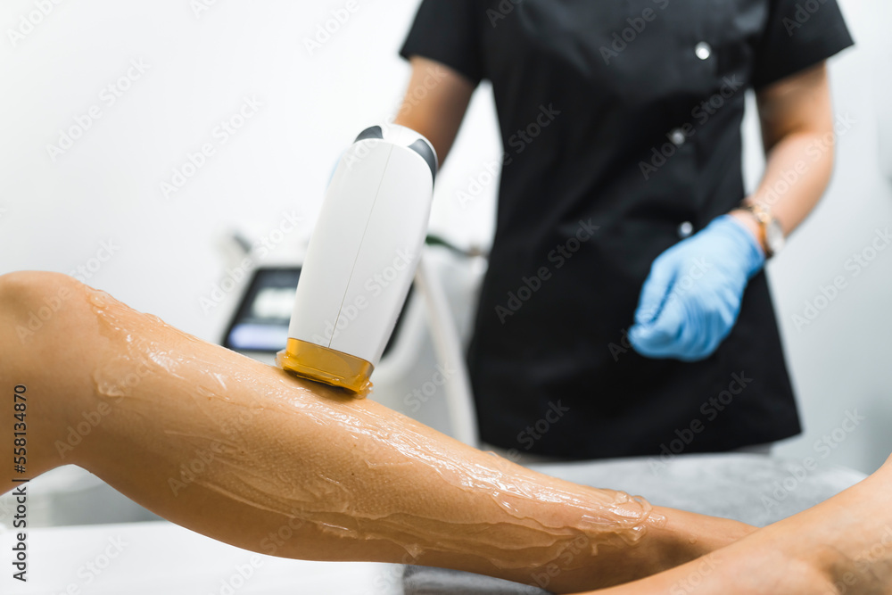 A close-up shot of a leg during a laser hair removal procedure. Beauty concept. High quality photo