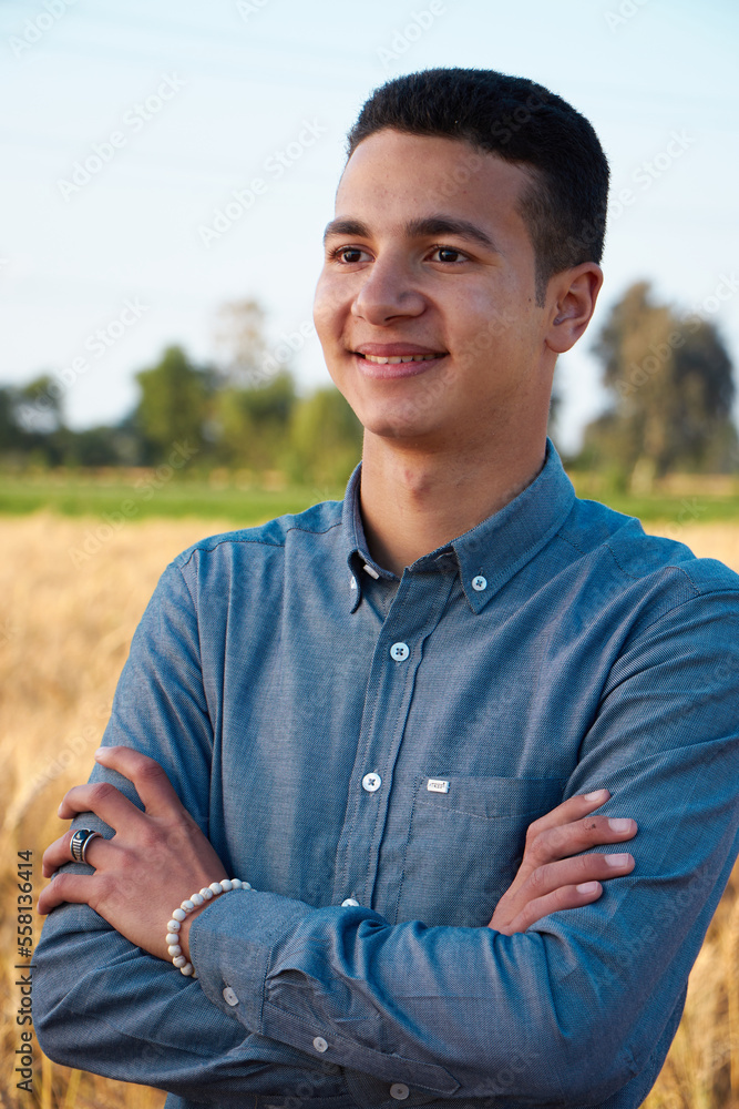 Man walking in wheat during sunset and touching harvest. Man walking in wheat during sunset and touching harvest.