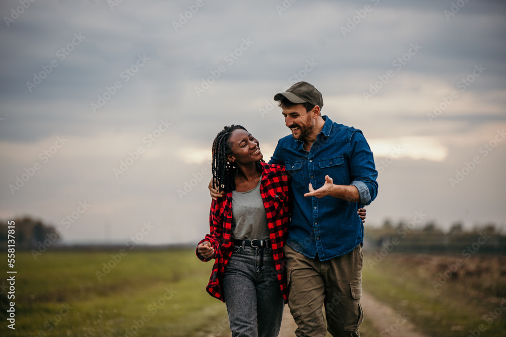 Shot of a loving young couple having fun outdoors in a grass field. Man and woman enjoying a day in a meadow. Shot of a loving young couple having fun outdoors in a grass field. Man and woman enjoying a day in a meadow.