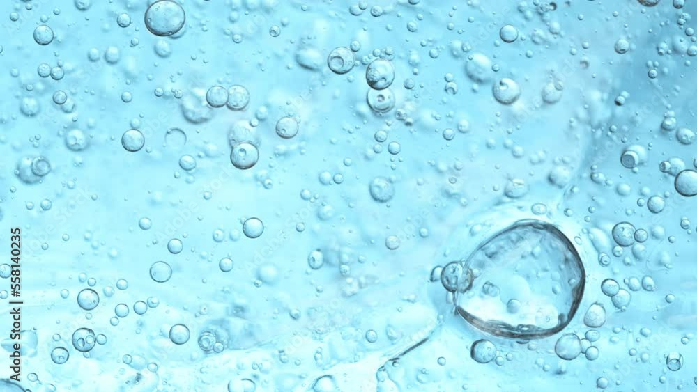 Super Slow Motion Shot of Oil Bubbles Moving in Water on Light Blue Gradient Background at 1000fps. Super Slow Motion Shot of Oil Bubbles Moving in Water on Light Blue Gradient Background at 1000fps.