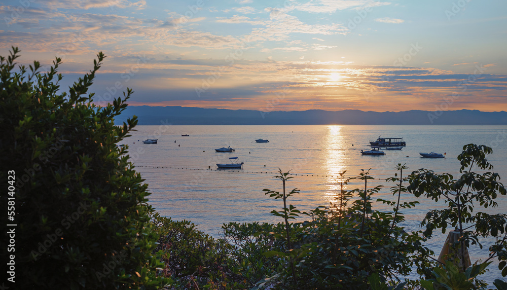 sunrise Kvarner Bucht, Moscenicka Draga. romantic scnenery with motorboats and mountains sunrise Kvarner Bucht, Moscenicka Draga. romantic scnenery with motorboats and mountains