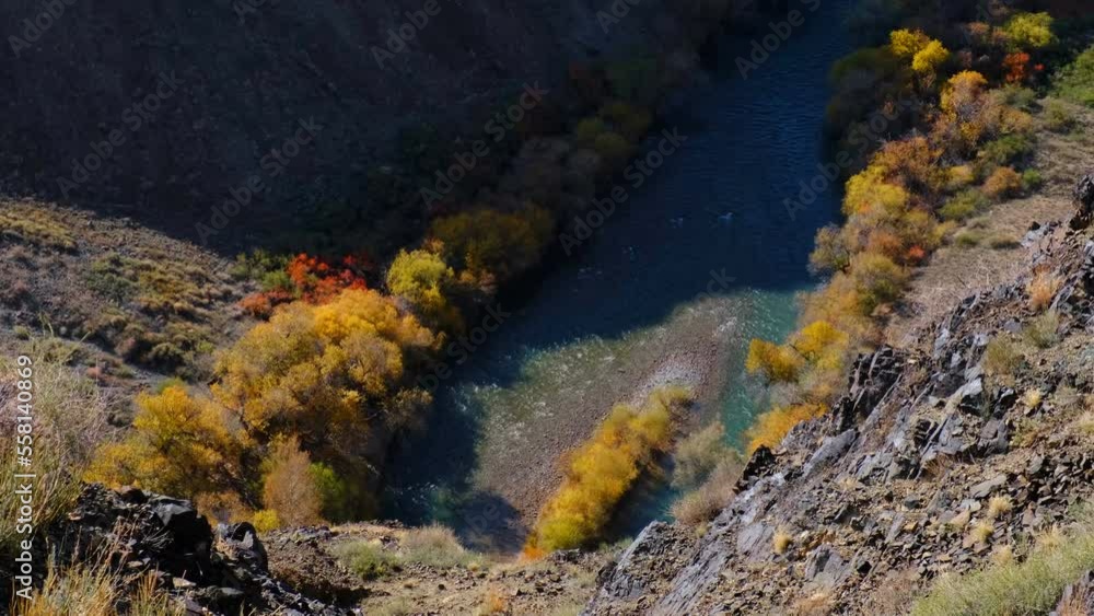 Wonderful view of Charyn canyon in the golden autumn season; crystal clear water of a mountain river Wonderful view of Charyn canyon in the golden autumn season; crystal clear water of a mountain river