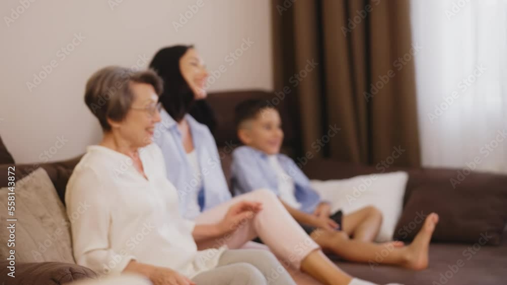 Granny, adult daughter and grandson in a hurry to watch comedy show together Granny, adult daughter and grandson in a hurry to watch comedy show together