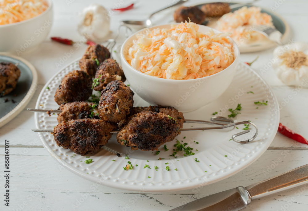 Cevapcici, serbian meatballs with delicious coleslaw Cevapcici, serbian meatballs with delicious coleslaw