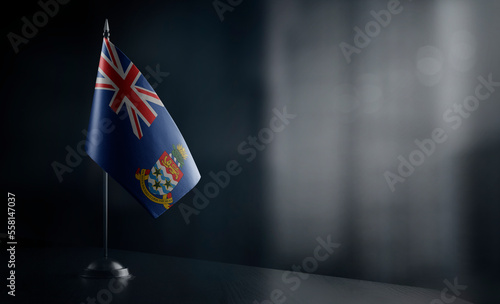 Small national flag of the Cayman Islands on a black background photo