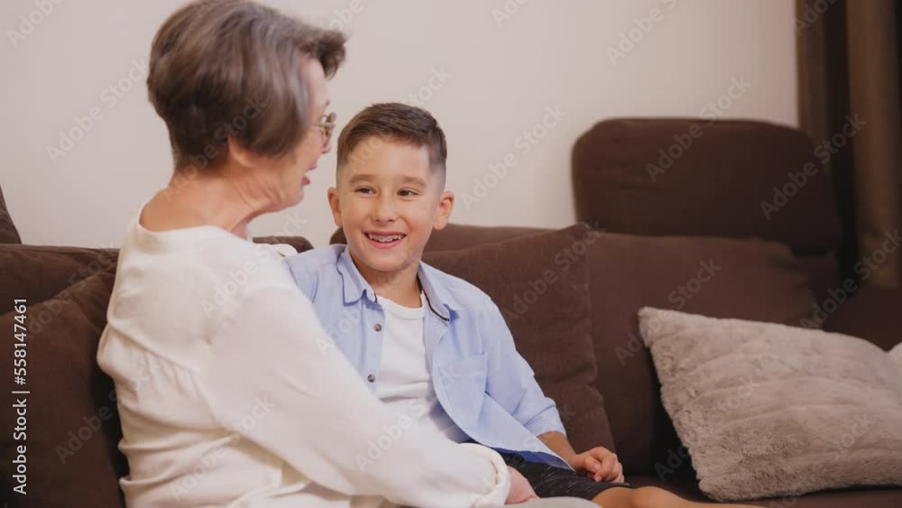 Cute boy having fun with his grandma, family spending time together at home Cute boy having fun with his grandma, family spending time together at home