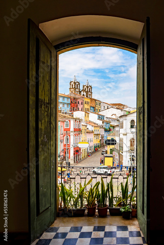 Open door in an old colonial house overlooking the Pelourinho neighborhood and its hillsides in Salvador, Bahia