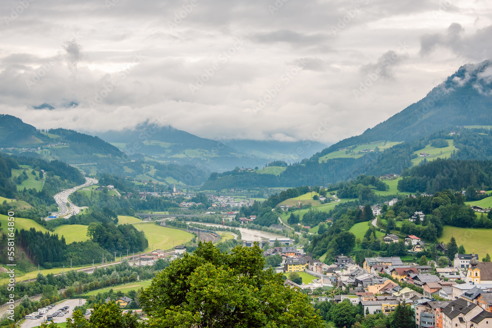 View over the Salzach river valley near town of Werfen, Austria on a cloudy rainy day.