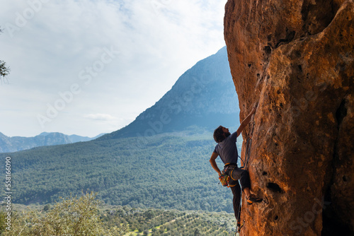 Rock climber climbing rock