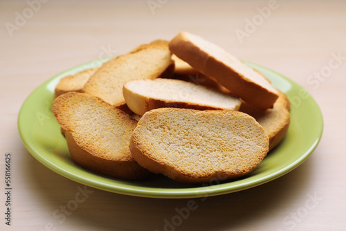 Plate of hard chuck crackers on wooden table