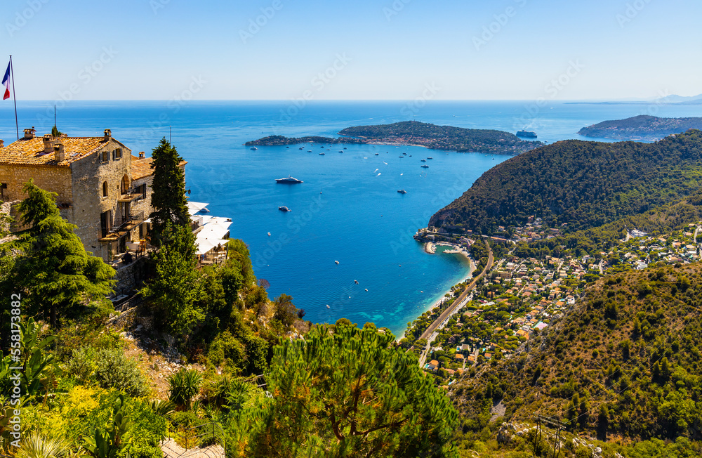 Panoramic view of Eze Bord de Mer, Silva Maris port and St. Jean Cap Ferrat cape seen from historic town of Eze over Azure Cost of Mediterranean Sea in France