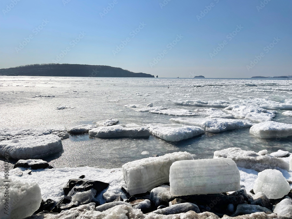 Blocks of ice off the coast of Patroclus (Patrokl) Bay at the end of winter. Russia, Vladivostok city