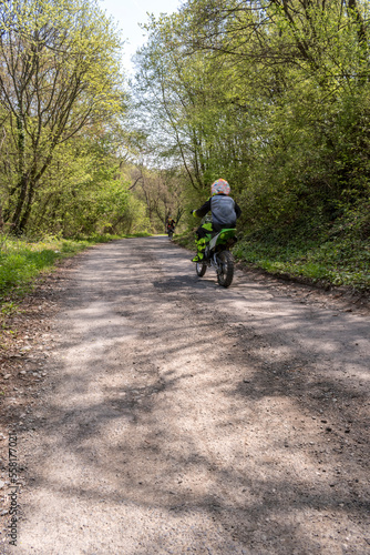 Wallpaper Mural A man driving a motorbike on the driveway in the park. Torontodigital.ca