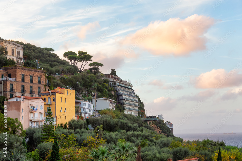 Rocky Coast and Homes in Touristic Town, Sorrento, Italy. Amalfi Coast. Colorful Sunset Sky