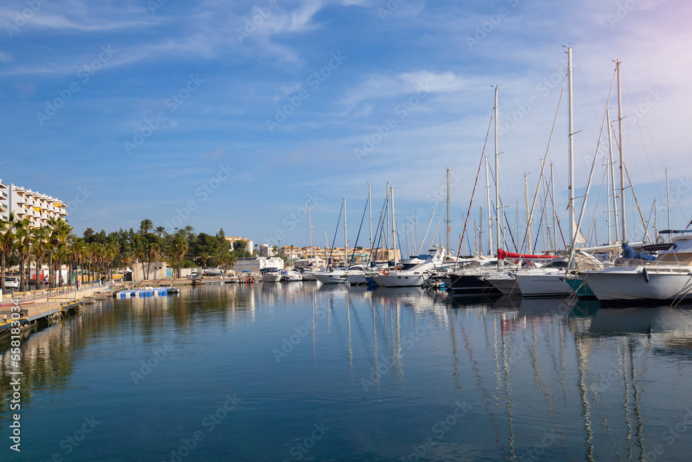 Mediterranean sea coast in the resort town overlooking the promenade and harbor with yachts, province of Alicante,Villa Hoyosa, Costa Blanca, Spain