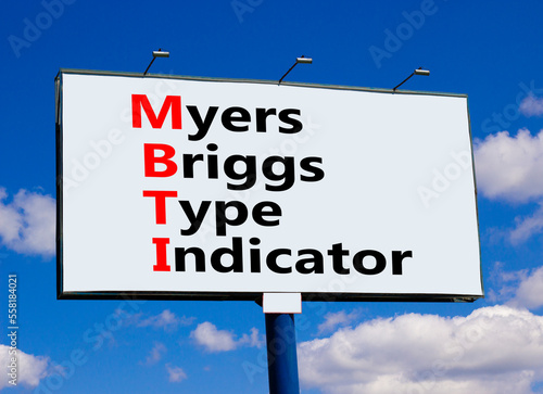 MBTI Myers Briggs type indicator symbol. Concept words MBTI Myers Briggs type indicator on big billboard against beautiful blue sky. Psychological MBTI Myers Briggs type indicator concept. Copy space photo