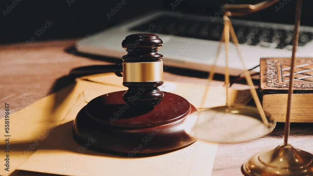 Business and lawyers discussing contract papers with brass scale on desk in office. Law, legal services, advice, justice and law concept picture with film grain effect Business and lawyers discussing contract papers with brass scale on desk in office. Law, legal services, advice, justice and law concept picture with film grain effect