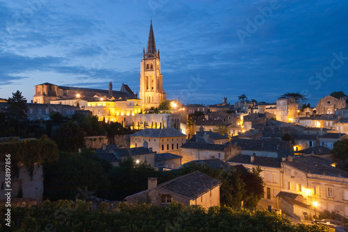 Print op canvas Overview of illuminated Saint Emilion village at dusk, famous for vineyards, in