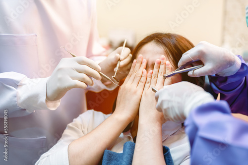 Quadro em tela Dentist examining teeth patients in clinic for better dental health and a bright smile