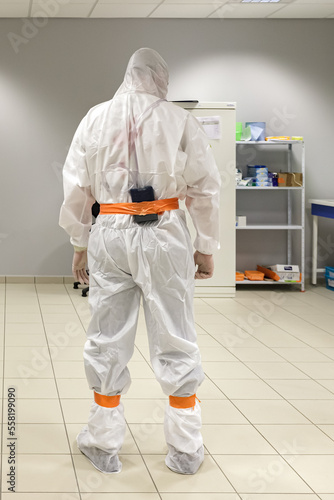 Personal Air Sampling pump, attached to an asbestos removal worker. This pump makes it possible to determine the operator's level of occupational exposure to asbestos
