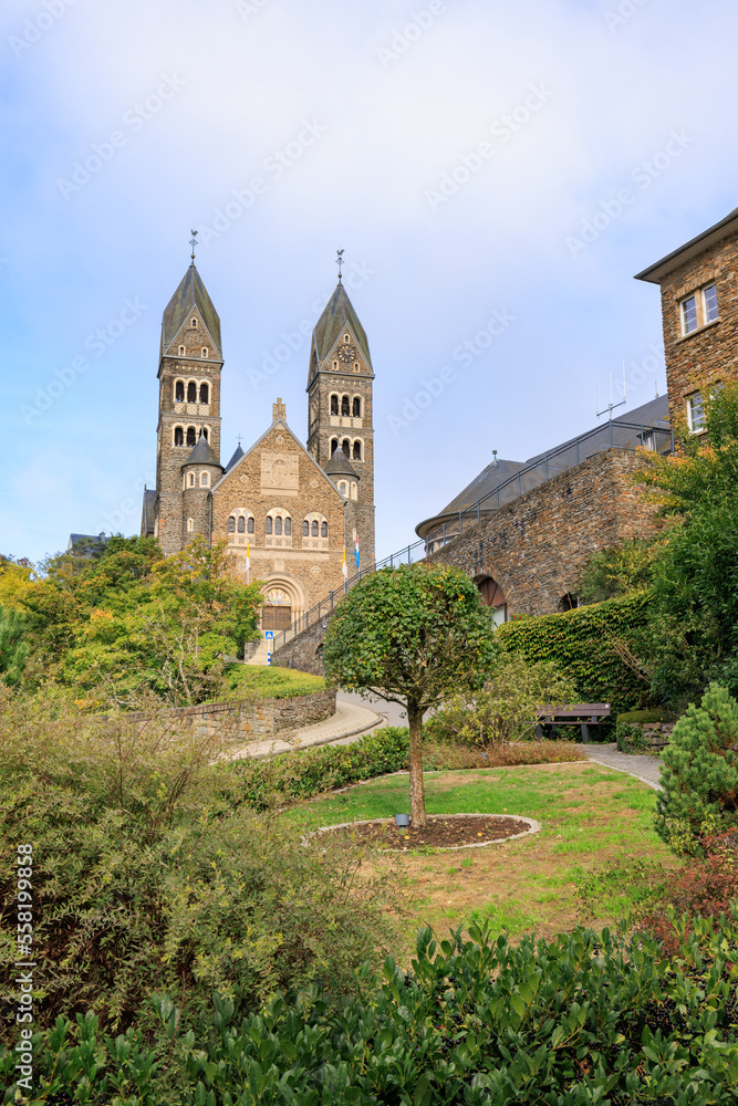 Clervaux, Luxembourg - October 3, 2022: Cityscape with roman catolic church Saints-Come-Et-Damien of Clervaux in Luxembourg
