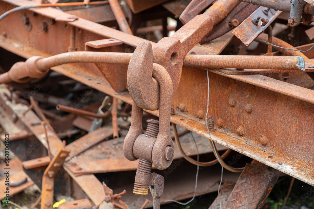 Photograph of old and rusty heavy duty metal hook attached to a large D-Bolt at the end of an unused and scrapped rail carriage Photograph of old and rusty heavy duty metal hook attached to a large D-Bolt at the end of an unused and scrapped rail carriage