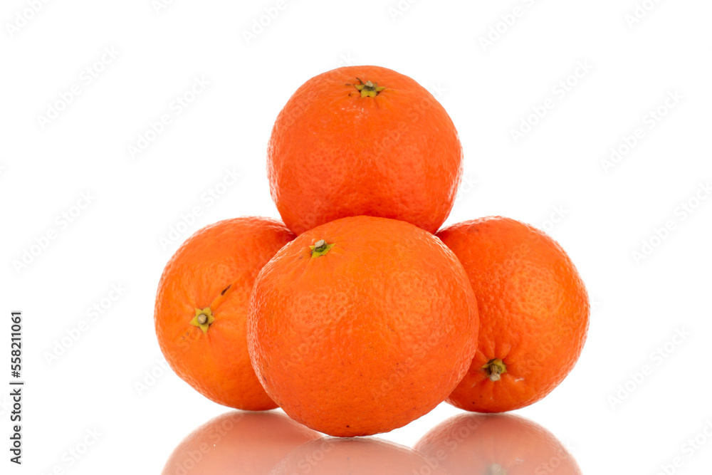 Several sweet organic tangerines, macro, isolated on white background. Several sweet organic tangerines, macro, isolated on white background.