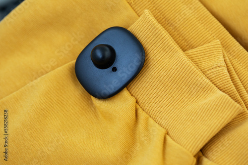 RFID radio tag for preventing theft, shoplifting. Security anti-theft sensor on clothing photo