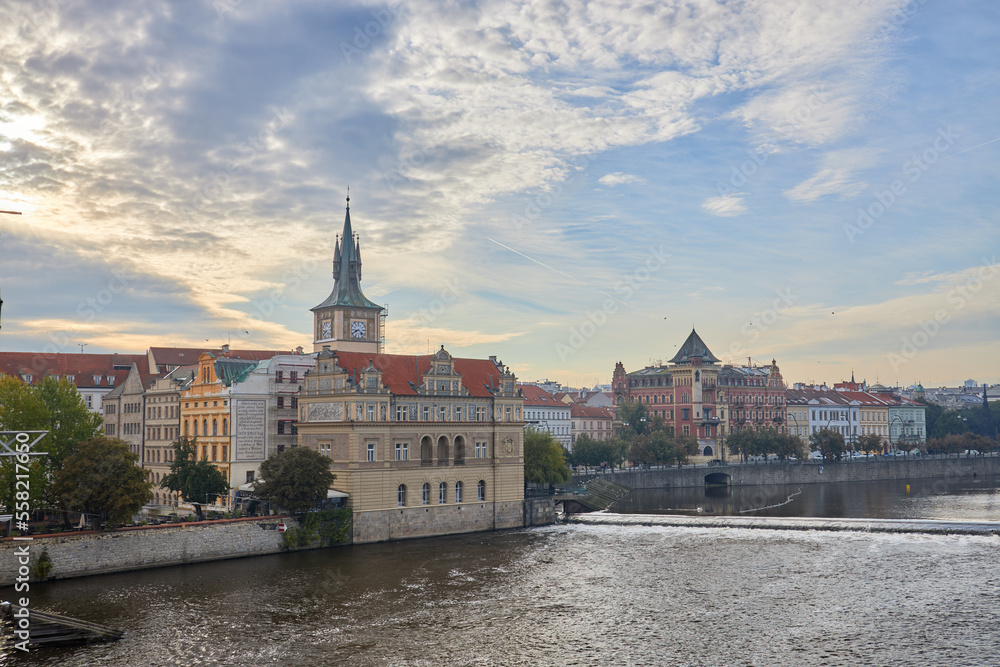 The bank of the Vltava flows through the town of Prague.