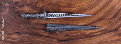 ceremonial dagger on wooden background