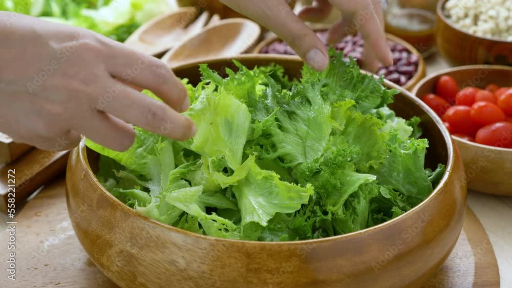 Mix Green Salad by Hand chef , Millet,Crab Stick In glass bowl. Breakfast fresh salad and clean vegetable can eat raw. Salad mix leaves green vegetable Mix Green Salad by Hand chef , Millet,Crab Stick In glass bowl. Breakfast fresh salad and clean vegetable can eat raw. Salad mix leaves green vegetable