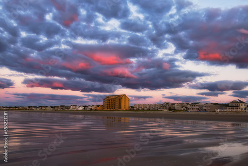 Sunrise on the ocean. Portland.  Resort coast. sandy beach at sunrise overlooking the coastline. Atlantic Ocean. USA. Maine. Old Orchard Beach.
