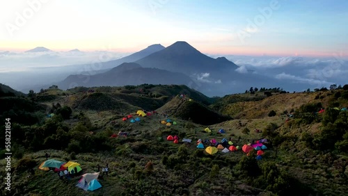 Aerial view of beauty mountain peaks Prau Dieng, Central Java and the climbers and tent.  photo