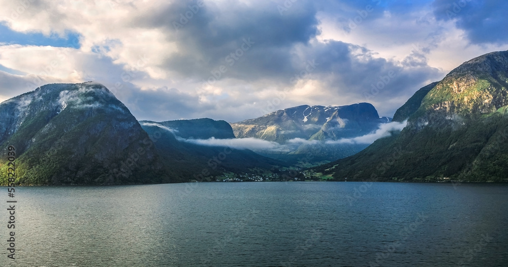 The shores of Norway.View of the mountainous rural landscape of the Norwegian fjord.