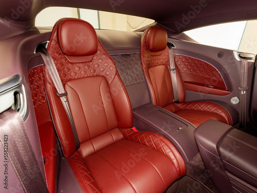 Red back passenger seats in modern luxury comfortable car © AvokadoStudio