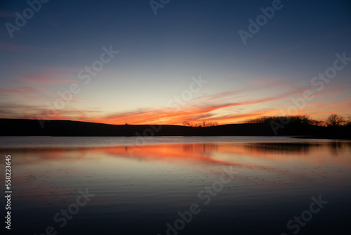 Sunset reflecting upon a pond.