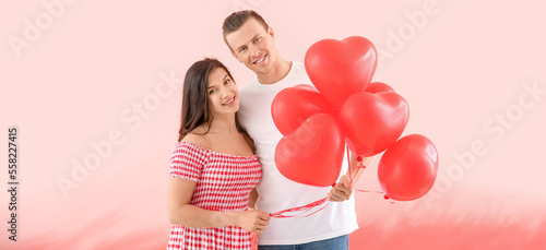 Happy young couple with bal...