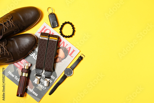 Fototapeta Naklejka Na Ścianę i Meble -  Stylish male shoes, accessories and car key on yellow background