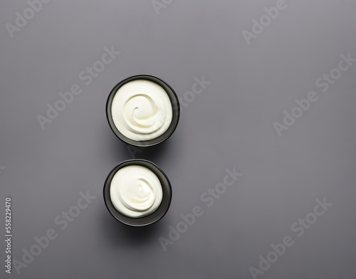 bowl of tasty mayonnaise on wooden background