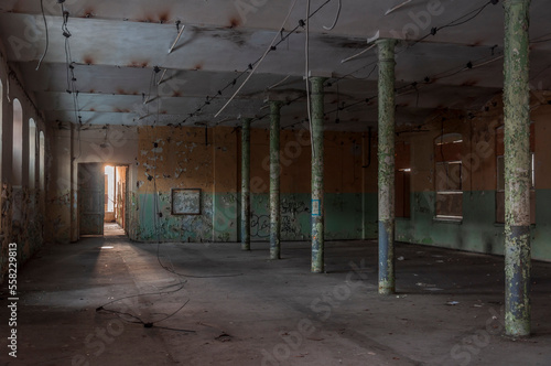 Old abandoned haunted red brick factory of stockings, pantyhose and socks in Central Europe, Poland