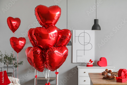 Heart-shaped balloons in living room decorated for Valentine's Day