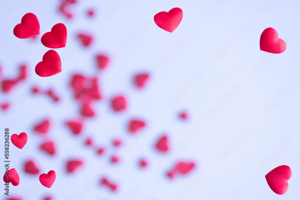 Red hearts on white background.  Large copy space area.  Two overexposed photos (no vector no illustration)
