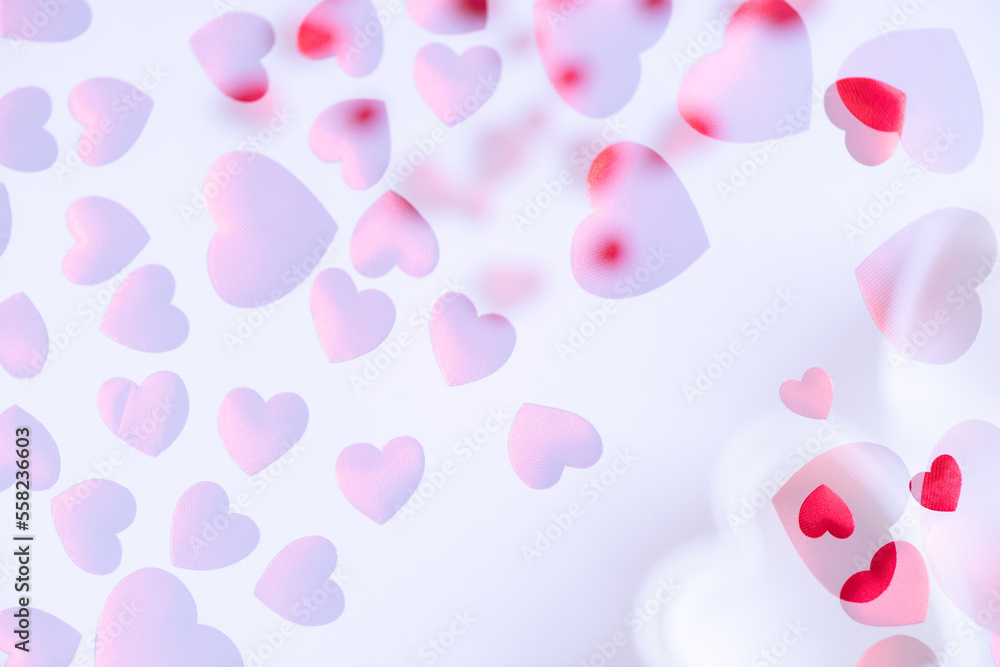 Red hearts on white background.  Large copy space area.  Two overexposed photos (no vector no illustration)