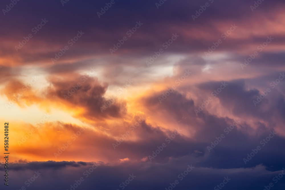 Beautiful storm cumulus clouds in the sky during sunrise or sunset, background