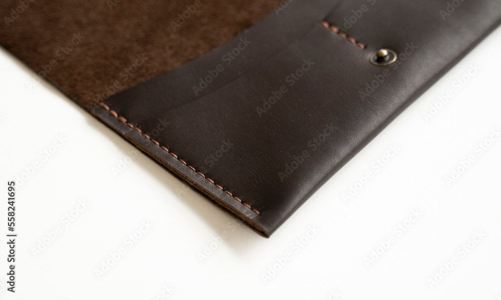 Details of open brown elegance men's wallet on a white background. Mens leather accessories. Details of open brown elegance men's wallet on a white background. Mens leather accessories.